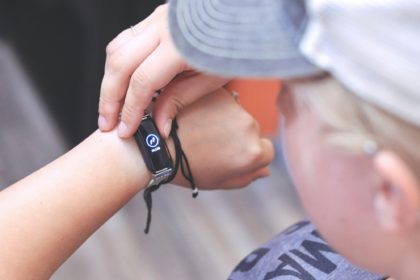 Woman Checking Her Daily Steps on a Fitness Tracking Bracelet